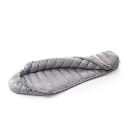 Gray down sleeping bag laid flat on a white background with quilted panels exposed.