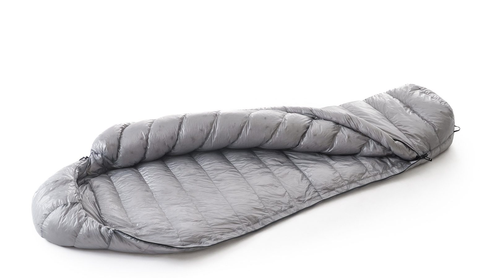 Gray down sleeping bag laid flat on a white background with quilted panels exposed.